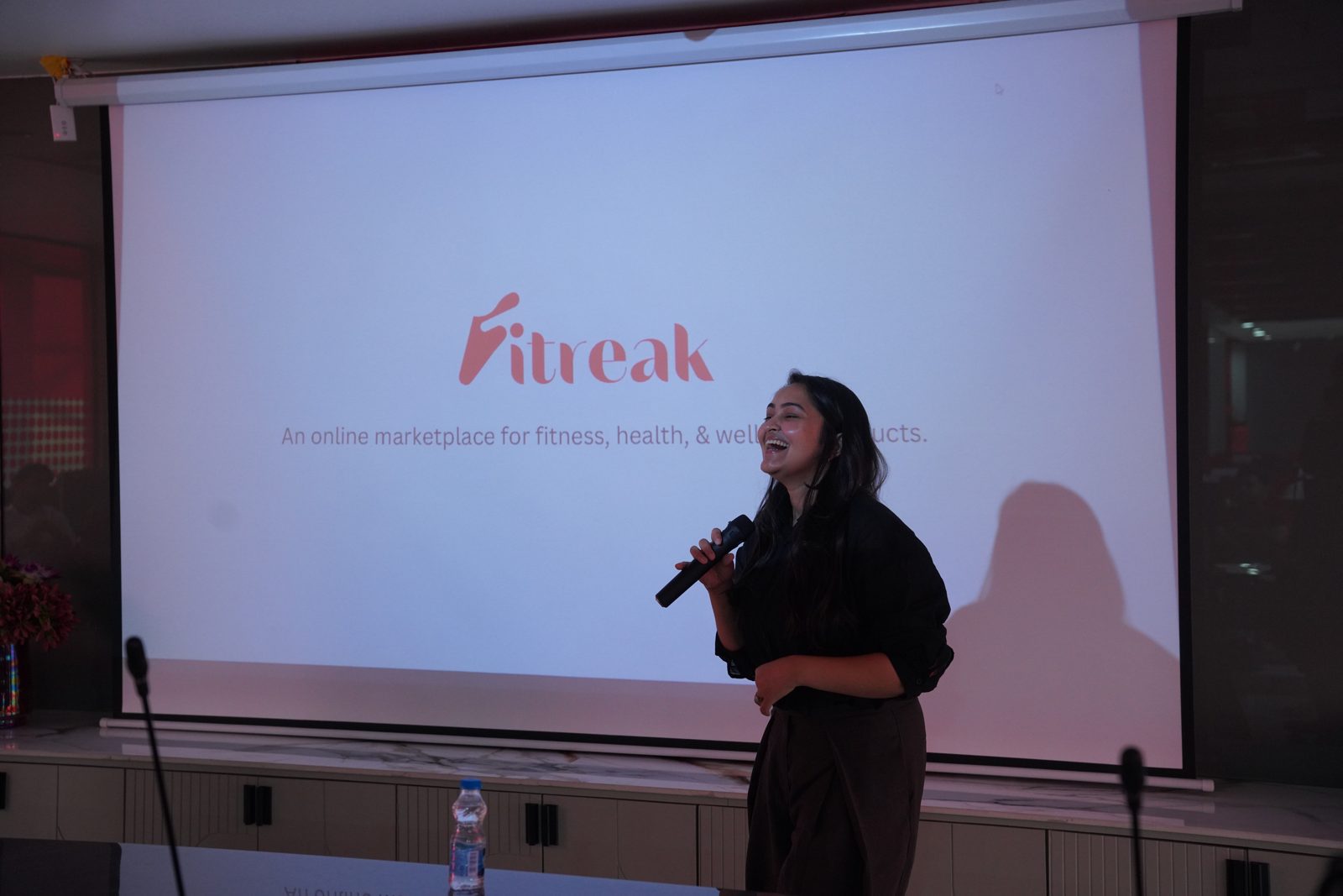 A founder pitching on stage